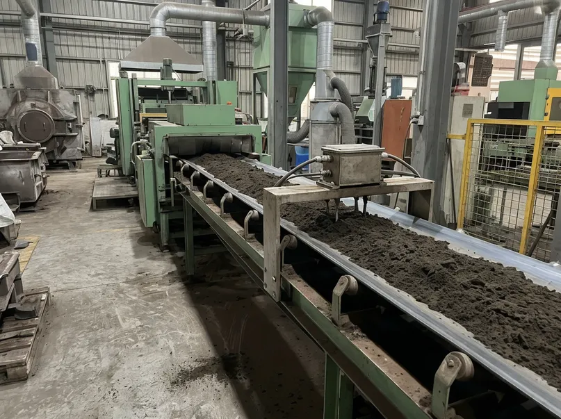 Sand preparation conveyor feeding into clay sand molding line with moisture sensor installed on belt